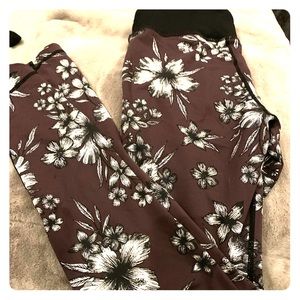 Purple floral leggings with black wasteband.